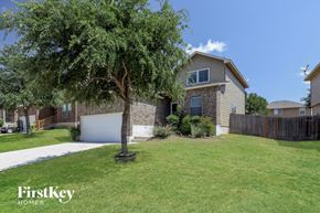 San Antonio house for rent - a house with a lawn and a tree in front of it