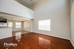 San Antonio house for rent - an empty living room with wood flooring and a window