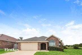 Denton house for rent - A house with a garage and a driveway is for sale.