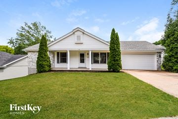 St. Louis house for rent - a white house with a lawn in front of it