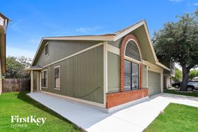 San Antonio house for rent - the exterior of a house with a driveway and a lawn