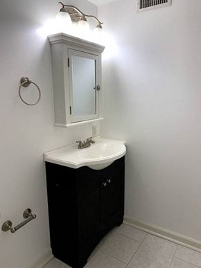 Philadelphia apartment for rent - a small bathroom with a sink and a mirror