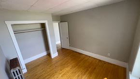 Pictou apartment for rent - a bedroom with a closet and a hard wood floor