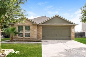 New Braunfels house for rent - A house with a garage and a driveway in front of it.