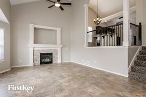 Kansas City house for rent - the great room with fireplace and staircase to the upper level