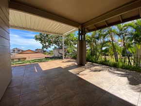 Kapolei apartment for rent - a patio with a view of trees and a house