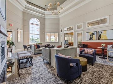Pikesville apartment for rent - a living room with couches and chairs and a fireplace