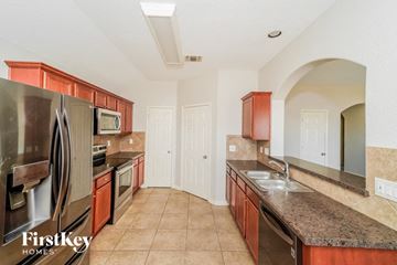 New Braunfels house for rent - a kitchen with granite counter tops and stainless steel appliances