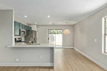 Mesa house for rent - A modern kitchen with a bar counter and a window.