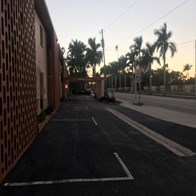 Fort Myers house for rent - an empty parking lot with palm trees in the background