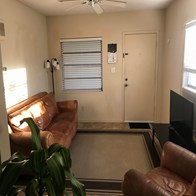 Fort Myers house for rent - a living room with a couch and a tv