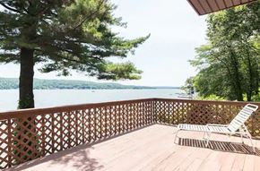 Greenwood Lake apartment for rent - a deck with a chair and a view of the water
