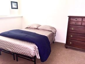 Grand Rapids apartment for rent - A bedroom with two beds and a dresser.