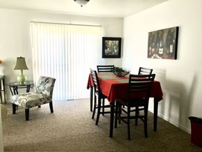 Grand Rapids apartment for rent - A dining room with a table set for two and a painting on the wall.
