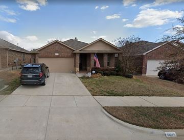 Denton house for rent - a car parked on a driveway in front of a house