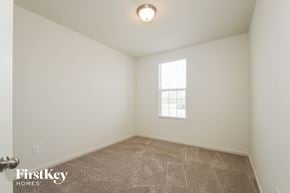 Avon house for rent - the living room of a home with a carpeted floor and a window
