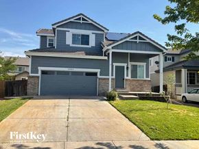Commerce City house for rent - A two-story house with a garage is for sale.