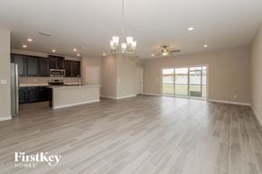 Jacksonville house for rent - A spacious kitchen with a refrigerator, microwave, and oven.
