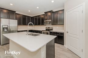 Jacksonville house for rent - A kitchen with a white countertop and stainless steel appliances.