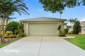 Mount Dora house for rent - A house with a garage door and a driveway.
