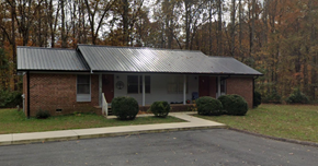 Dawsonville apartment for rent - a small brick house with a metal roof
