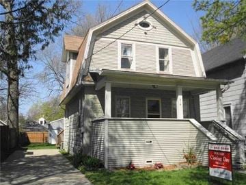 Lansing house for rent - a house with a foreclosure sign in front of it
