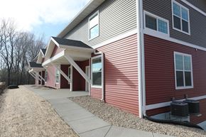 Mount Horeb house for rent - a red and white house with a sidewalk and a porch