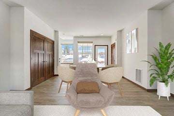 Mount Horeb house for rent - a living room with a couch and a table with chairs