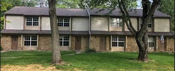 Noblesville apartment for rent - a house with two trees in front of it