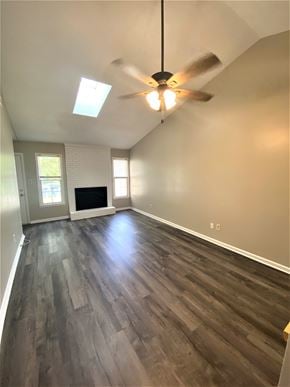 Jacksonville house for rent - an empty living room with wood floors and a ceiling fan