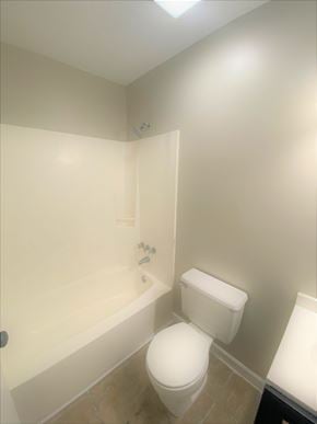 Jacksonville house for rent - a bathroom with a toilet and a bath tub