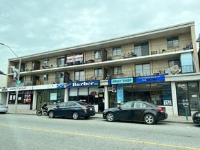 Windsor apartment for rent - a city street with cars parked in front of a building