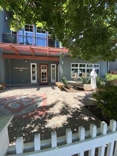 Redwood City apartment for rent - a house with a courtyard and a white fence