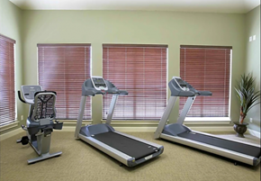 Copperas Cove townhouse for rent - two treadmills in a gym with windows blinds