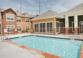 Copperas Cove townhouse for rent - a swimming pool in front of a building