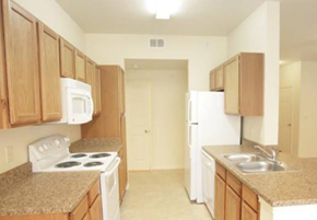 Copperas Cove townhouse for rent - a kitchen with a stove refrigerator and a sink
