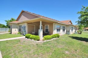 Boerne apartment for rent - the front of a house with a lawn and a porch