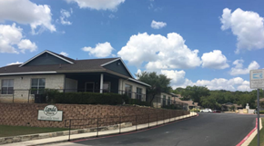 New Braunfels triplex for rent - a row of houses on the side of a road