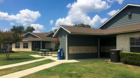 New Braunfels triplex for rent - a house with a picnic table outside of it