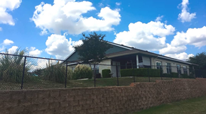 New Braunfels triplex for rent - a house with a fence in front of it