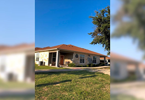 Weatherford townhouse for rent - a house with a red roof and a yard