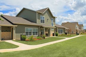 Fredericksburg townhouse for rent - a row of houses with a lawn in front of them