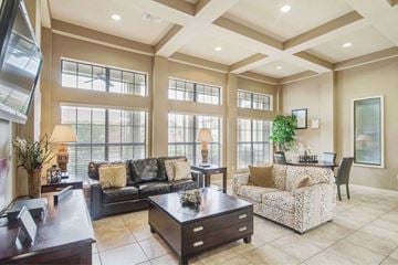 Cleburne townhouse for rent - a large living room with a couch and a table