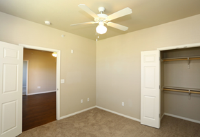 Midland apartment for rent - a bedroom with a ceiling fan and a closet