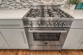 Somerville apartment for rent - a stainless steel stove top oven in a kitchen
