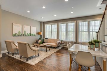 Somerville apartment for rent - a living room with couches and chairs and a table