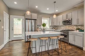 Somerville apartment for rent - a kitchen with an island and three stools
