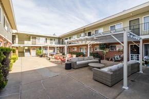 Oakland apartment for rent - A sunny day at the outdoor patio of apartment buildings.