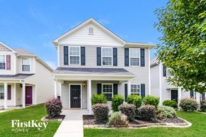 Winston Salem house for rent - a white house with black shutters and a lawn