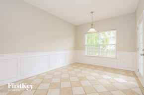 Murfreesboro house for rent - an empty dining room with white walls and a window